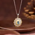 Exquisite close-up of a floral pendant necklace featuring a central blue topaz gemstone - Sunflower Style / Natural Topaz Necklace