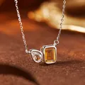 Close-up of S925 silver necklace featuring teardrop topaz and emerald-cut citrine - Natural Citrine & White Crystal