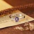 Close-up of a rectangular purple gemstone set in an S925 sterling silver ring band - Natural Tanzanite Silver