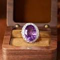 Close-up of a large oval millennium cut amethyst ring in a decorative silver setting - Oval Cut Ring (R609) / Natural Amethyst Ring