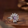 Close-up of s925 silver daisy ring featuring an oval purple amethyst and zircons. - Ring / Natural Amethyst