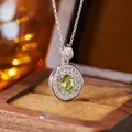 Silver pendant with oval green gemstone and white pave stones in a luxury wooden box - Natural Olivine Silver