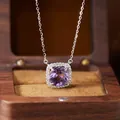 Close-up of a premium sterling silver necklace with a halo-set purple amethyst pendant - Natural Amethyst Necklace