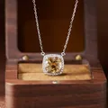 Macro view of cushion-cut citrine necklace pendant in sterling silver Diana style setting - Natural Citrine Necklace