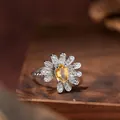 Macro detail of a daisy-shaped s925 silver ring with a yellow citrine gemstone center. - Ring / Natural Citrine