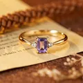 Macro view of an elegant gold-plated silver ring with a rectangular purple amethyst - Natural Tanzanite Gold
