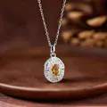 Close-up detail of a natural yellow citrine oval pendant on an S925 silver chain. - Natural Citrine Necklace (White Gold Color)