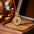 Macro detail showing a gold-plated S925 silver necklace with a sparkling citrine pendant. - Natural Citrine Gold