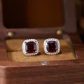 Detailed view of S925 sterling silver cushion-cut red gemstone halo stud earrings - Natural Garnet Stud Earrings