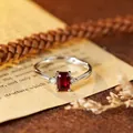 S925 sterling silver ring with emerald cut red gemstone and vintage prop background - Natural Garnet Silver