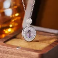 Detailed macro view of an S925 sterling silver amethyst pendant in a wooden gift box - Natural Amethyst Silver
