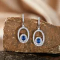 Elegant S925 sterling silver dangle earrings with oval blue sapphire and pavé stones - Stud Earrings / Sapphire