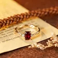 Elegant gold-plated S925 silver ring with a red emerald-cut gemstone and side crystals - Natural Garnet Gold