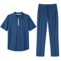 Detail view of a blue 2-piece men's casual set featuring a piqué polo shirt and trousers - S / Top And Bottom / Sapphire Blue