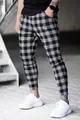 Close-up of men's slim-fit plaid casual pants with black and white checker pattern - S / Bottoms / Black