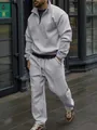 Detail view of men's ribbed tracksuit set showing fit and texture in urban setting - S / Top And Bottom / Gray