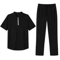 Detail view of the black men's casual two-piece set with polo shirt and long pants - S / Top And Bottom / Black