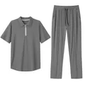 Detailed view of grey men's pique polo shirt and pants casual two-piece set. - S / Top And Bottom / Gray