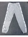 Detailed close-up view of grey sports joggers featuring side snap buttons and white stripes. - S / Bottoms / Light Gray
