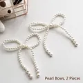 Elegant white pearl bowknot charms for gift and bouquet decoration, 2 pieces per pack. - Bowknot Pearl Decoration / Set of 2