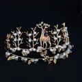 Elegant gold-tone bridal crown featuring an intricate reindeer design and faux pearl accents - Handmade Deer Crown (047)