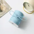 Light blue double-sided faux suede cord on white spool for DIY handmade flower packaging - 50 Yards / Light Blue