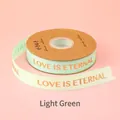 Hellgrünes 2,5cm Ripsband mit Goldprägung 'LOVE IS ETERNAL' für Geschenkverpackungen - Englisch Love Is Eternal / 2.5cm Breite / 32 Yards / Hellgrün