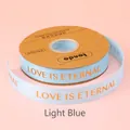Hochwertiges hellblaues 2,5cm Ripsband mit goldenem 'LOVE IS ETERNAL' Schriftzug - Englisch Love Is Eternal / 2.5cm Breite / 32 Yards / Hellblau