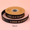 Schwarzes 2,5 cm Ripsband mit goldenem Love is Eternal Aufdruck für Geschenke - Englisch Love Is Eternal / 2.5cm Breite / 32 Yards / Schwarz