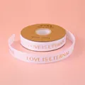 Weißes Ripsband mit Goldfolien-Aufdruck LOVE IS ETERNAL für Blumen-Geschenkverpackungen - Englisch Love Is Eternal / 2.5cm Breite / 32 Yards / Weiß