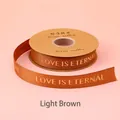Hellbraunes Ripsband mit Goldfolie LOVE IS ETERNAL Text für Geschenkverpackungen - Goldfolie Love Is Eternal / 2.5cm Breite / 32 Yards / Hellkaffee