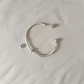 Detailed macro view of a silver stainless steel screw-off ball end cuff bracelet - Unscrewed Ball Head DIY Open Bangle (YB-1089S) / Inner Diameter 65mm (With 2 Positioning Beads) / Steel