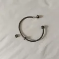 Detailed macro shot of gunmetal titanium steel open bangle with a screw-off ball end - Unscrewed Ball Head DIY Open Bangle (YB-1089BLK) / Inner Diameter 65mm (Including 2 Positioning Beads) / Black