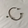 Close-up detail showing the screw-off ball end on a gunmetal stainless steel cuff bracelet - Unscrewed Ball Head DIY Open Bangle (YB-1089BLK) / Inner Diameter 70mm (Including 2 Positioning Beads) / Black