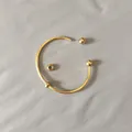 Close-up of golden stainless steel open bangle with screw-on detachable ball ends - Unscrewed Ball Head DIY Open Bangle (YB-1089G) / Inner Diameter 65mm (Including 2 Positioning Beads) / Gold