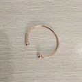 Detail of rose gold stainless steel open bangle with ball head ends on wood background - Unscrewed Ball Head DIY Open Bangle (YB-219RG) / Inner Diameter 65mm / Rose Gold