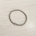 Detailed view of a silver stainless steel beaded bracelet with a heart initial B charm. - Heart Initial B Style (YB-S1090-B) / Stretchy