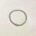 Close-up of heart charm on silver stainless steel beaded elastic bracelet with letter D - Heart Initial D Style (YB-S1090-D) / Stretchy