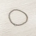 Detail of silver stainless steel bead bracelet featuring an engraved heart 'G' charm. - Heart Initial G Style (YB-S1090-G) / Stretchy