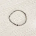 Close-up of stainless steel bead bracelet featuring a heart charm with letter K engraving - Heart Initial K Style (YB-S1090-K) / Stretchy