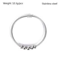 Close-up of a sleek stainless steel spring tube bangle featuring five polished beads - 5 Simple Beads Style (YB-027) / Silver
