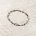 Close-up of stainless steel beaded bracelet featuring a heart-shaped 'R' initial charm - Heart Initial R Style (YB-S1090-R) / Stretchy
