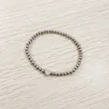 Macro view of stainless steel beaded bracelet with engraved heart initial charm - Heart Initial V Style (YB-S1090-V) / Stretchy