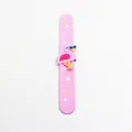 Detailed view of pink flamingo slap bracelet with star patterns and silicone character decoration. - Pink