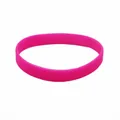 Detailed view of a bright pink silicone luminous wristband on white background - Rose Red