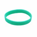 Close-up of plain green glow-in-the-dark silicone wristband for sports and events - Teal