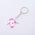 Niedlicher Einhorn-Schlüsselanhänger aus PVC-Weichgummi mit Regenbogenhorn und Mähne - Lila Mähne Kopf