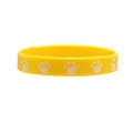 Vibrant yellow silicone bracelet featuring white cat paw prints, ideal for party gifts - Yellow