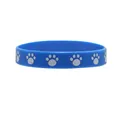 Blue silicone wristband featuring white paw print design for animal themed parties - Blue
