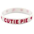 Close-up of white silicone Valentine's wristband with red Cutie Pie text and hearts - Style 3 (White CUTIE PIE)